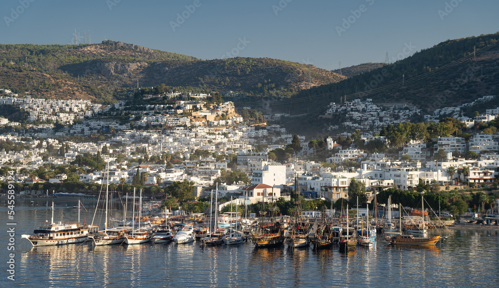Aerial view of Bodrum bay, Turkey. Seashore, sailboats, boats, mountains and fort in Bodrum. 