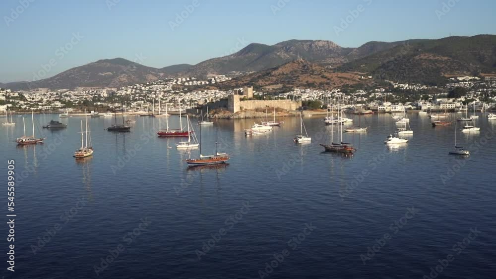 Aerial view of Bodrum bay, Turkey. Seashore, sailboats, boats, mountains and fort in Bodrum. Aerial view of Bodrum bay, Turkey. Seashore, sailboats, boats, mountains and fort in Bodrum.