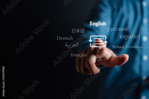 Businessman touching to virtual translation or translate on the mobile app worldwide language conversation speaking concept. photo