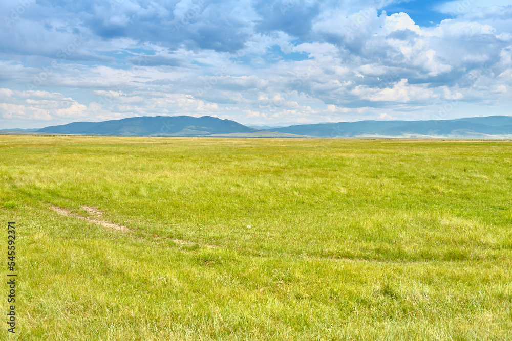 Steppe in the Barguzin Valley of the Republic of Buryatia on a clear sunny day.
