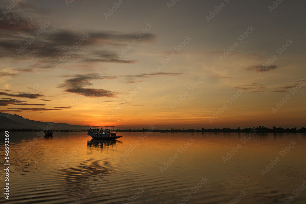 Sun rising at lake