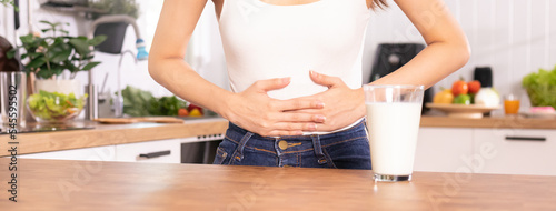 Konstfotografi Pain, allergy asian young woman, girl hand in belly suffer after drink glass of milk, unhappy and bad stomach ache