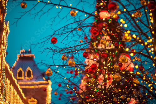 Blurred Christmas background made of Christmas tree lights © Oxana