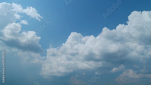 Cloud formation. Formation of a cumulonimbus cloud on a sunny day. Cumulus clouds in blue sky at border storm front. Timelapse.