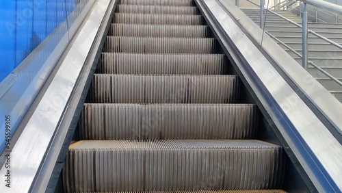 Moving escalators and metal steps of the kolkata metro station. Metro station in Kolkata, India. photo