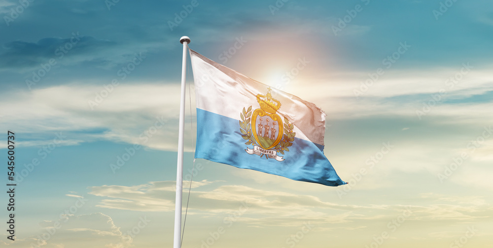 San Marino national flag cloth fabric waving on the sky - Image