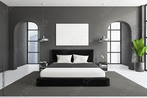 Front view on dark bedroom interior with empty white poster