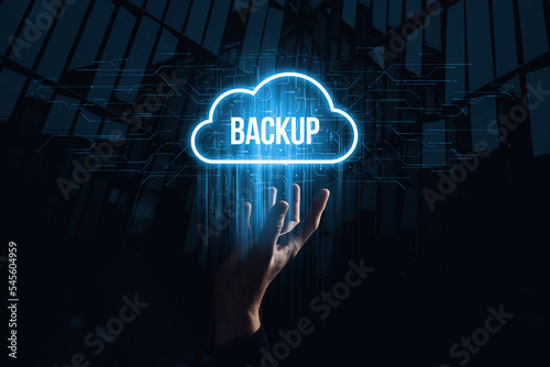 Data backup for data recovery to original or new location. Hologram in the form of a cloud over the hand