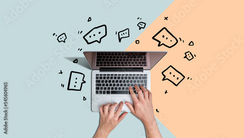 Real-time computer network messaging facility. Person chatting using laptop with icons beside