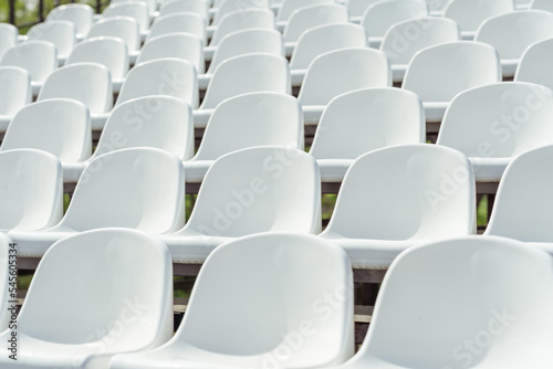 Seats of tribune on sport stadium. Concept of fans, chairs for audience, cultural environment concept. mpty seats, modern stadium.