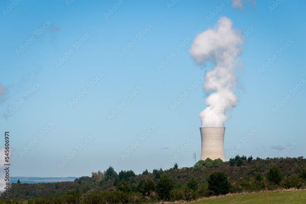 Industrial chimney with heavy white smoke causing air pollution