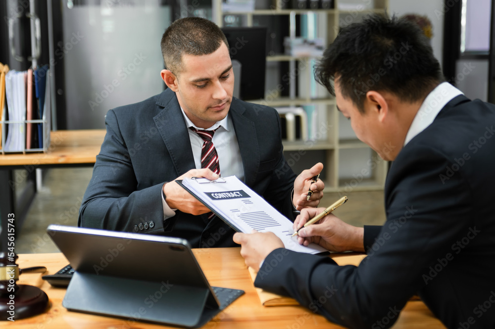 Businessman or judge consult and conference having team meeting with client at law firm in office. Businessman or judge consult and conference having team meeting with client at law firm in office.