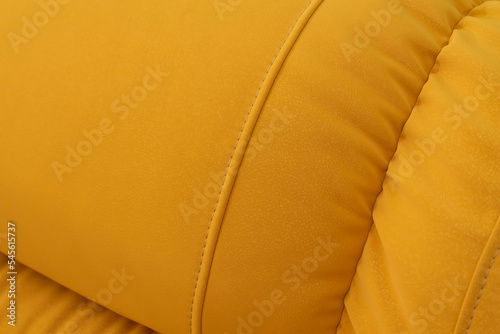 double cozy yellow fabric sofa. even seams close-up