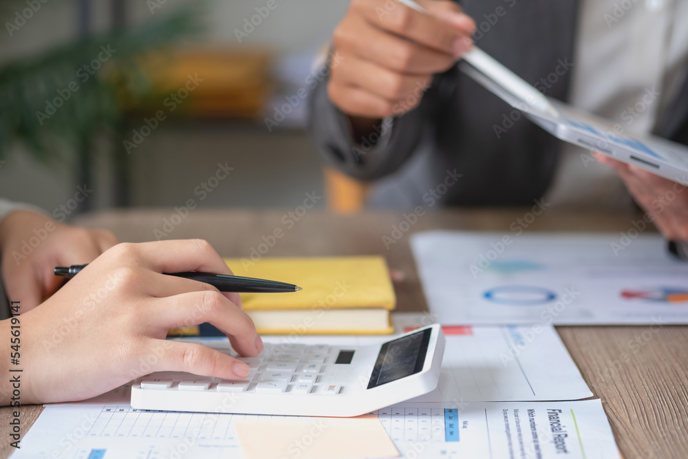 Fototapeta premium Marketing, Finance, Accounting, Planning, Team of business use calculators and graph analysis computer laptop tablets to plan marketing strategies and make profitable investments for the company.