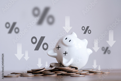 The financial crisis, end of savings, bankruptcy. Devaluation, inflation. Impoverishment. world economics, and inflation control. The dead piggy bank lies upside down on coins. Economic depression.