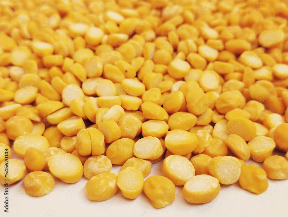 Split chickpeas legume dal chana Bengal gram lentils pulse yellow organic food full with protein harbara channa daal uncooked splitchickpea closeup image picture stock photo selective focus on front Split chickpeas legume dal chana Bengal gram lentils pulse yellow organic food full with protein harbara channa daal uncooked splitchickpea closeup image picture stock photo selective focus on front