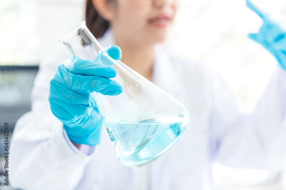 Close up hand scientists study cell health care and researchers doing some research with dropper chemical testing and working in life science laboratory