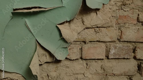 Abstract patterns and textures - old ageing cracked red bricks wall. Brick wall - detail. Brick wall made of red bricks with old fallen plaster.