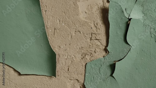 Concrete wall with cracks and old plaster. Concept of the destruction of building in disrepair.