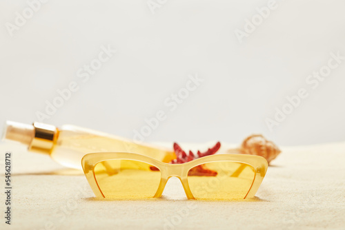 selective focus yellow sunglasses suntan