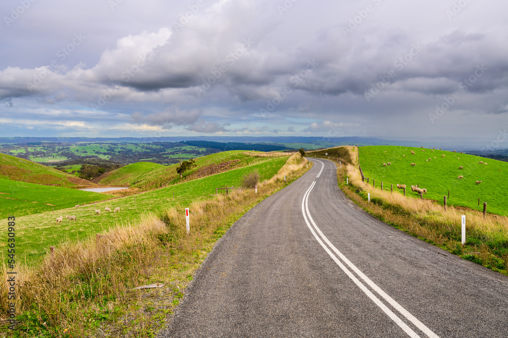 Winding road through Adelaide Hills farms during winter season, South Australia Winding road through Adelaide Hills farms during winter season, South Australia