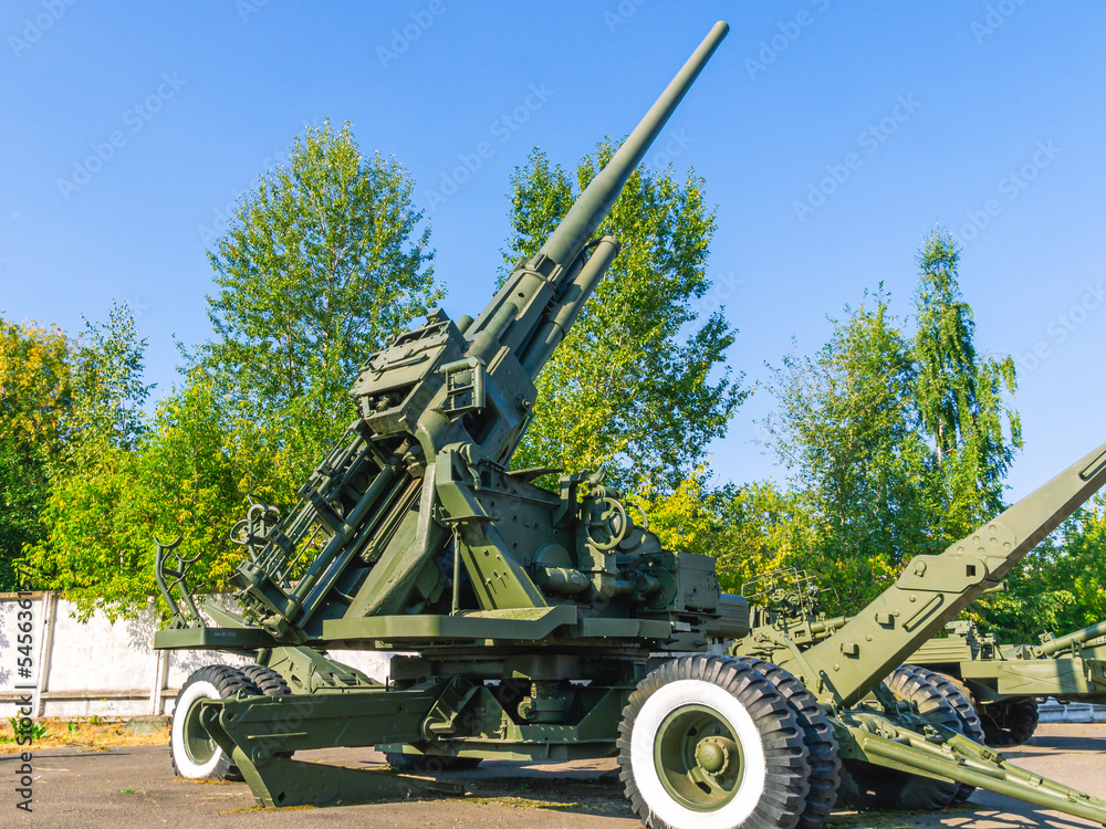 Soviet anti-aircraft gun. Anti-aircraft gun in the marching position. Towed wheeled gun. Armament of the army. Soviet anti-aircraft gun. Anti-aircraft gun in the marching position. Towed wheeled gun. Armament of the army.
