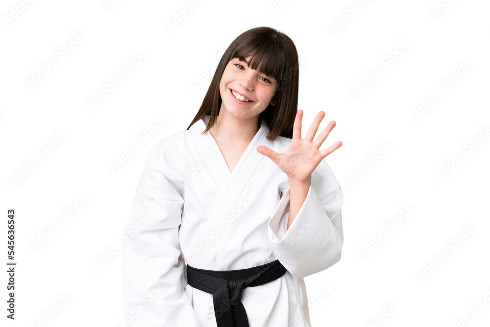Little Caucasian girl doing karate over isolated background counting five with fingers Little Caucasian girl doing karate over isolated background counting five with fingers