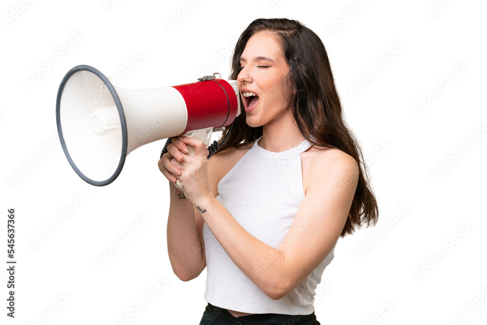 Young caucasian woman isolated over isolated background shouting through a megaphone Young caucasian woman isolated over isolated background shouting through a megaphone