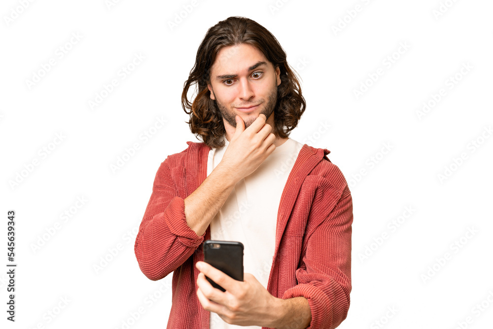 Young handsome man over isolated background thinking and sending a message Young handsome man over isolated background thinking and sending a message
