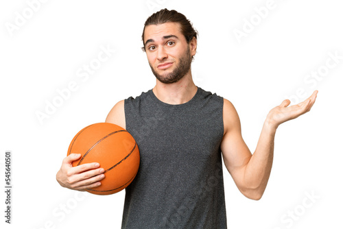 Young basketball player man over isolated background having doubts while raising hands