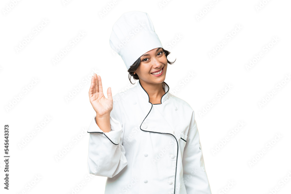 Young chef Argentinian woman over isolated background saluting with hand with happy expression Young chef Argentinian woman over isolated background saluting with hand with happy expression
