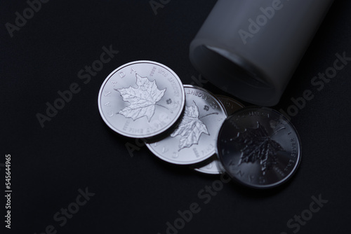 Maple leaf fine silver coins. Tube in the background. 