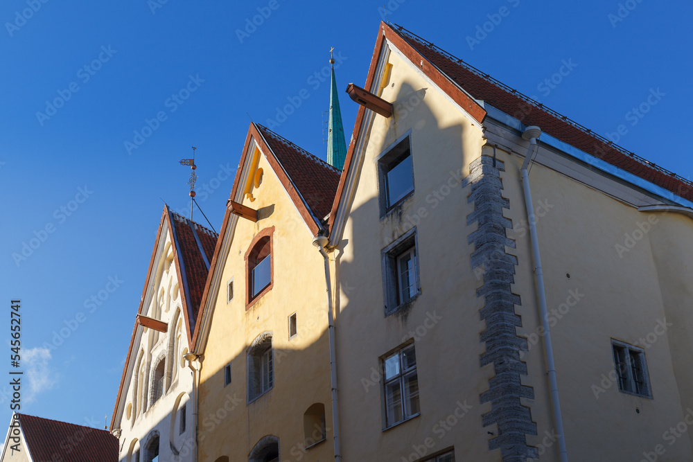 Oldest houses called Three Sisters. Streets of old town of Tallinn. Autumn daytime.
