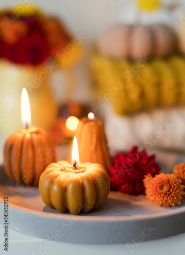 Cozy autumn mood. Flowers and candles © aprilante