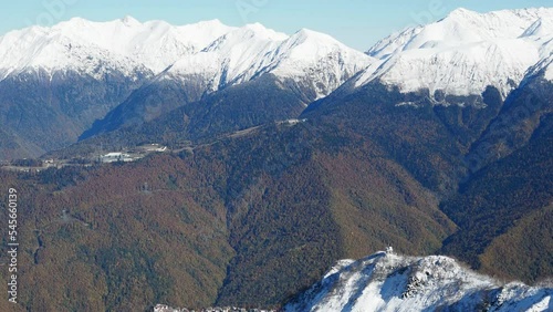 Beautiful mountain landscape in winter. First snow on the branches. Panoramic view from Alpaca Gazprom Resort. Late autumn.