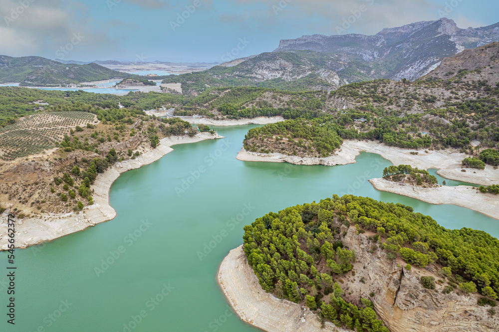 The drone aerial view of  Guadalhorce reservoir in the mountains of Andalusia in southern Spain in summer. 