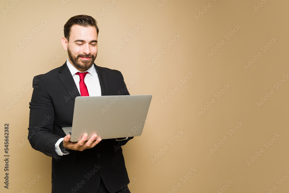 Happy lawyer or businessman using a laptop Happy lawyer or businessman using a laptop