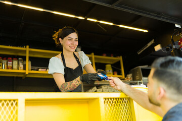 Beautiful food stall vendor with a customer at the food truck