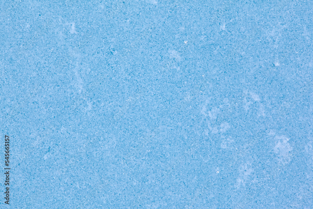 Texture of winter ice surface. Blue natural ice background