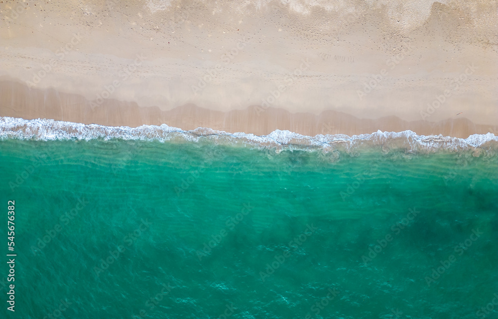 Aerial drone view (top down) to sea waves and white sand. Turquoise blue water, tropical theme. Concept of relaxation in pure nature. Aerial drone view (top down) to sea waves and white sand. Turquoise blue water, tropical theme. Concept of relaxation in pure nature.