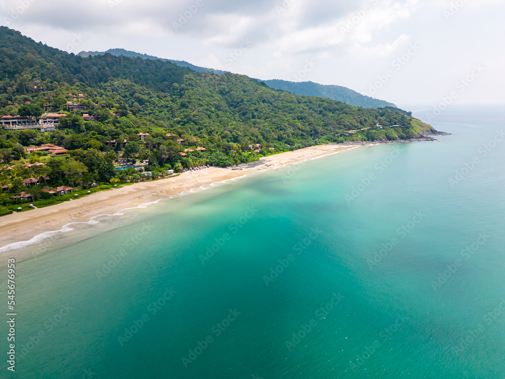 Aerial drone view of bamboo bay and beach at Koh Lanta island, Thailand. Tropical forest near the rocky beach and white sand with turquoise water.