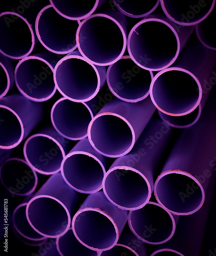 Background of the pink plastic pipes in stacked