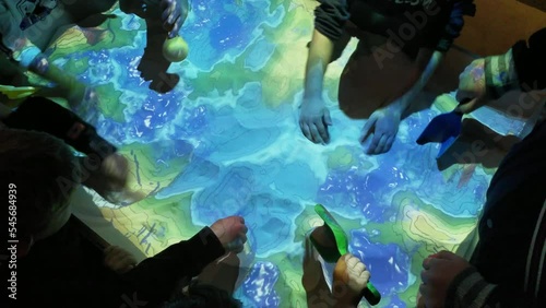 children learning and playing in a alternate reality / virtual reality sandbox simulation in the metaverse