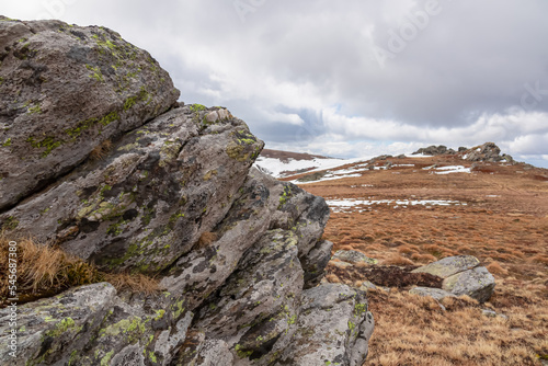 Scenic view of rock formations Steinerne Hochzeit on the hiking trail from Klippitztoerl to Ladinger Spitz, Saualpe, Lavanttal Alps, border Styria Carinthia, Austria, Europe. Early spring in Wolfsberg photo