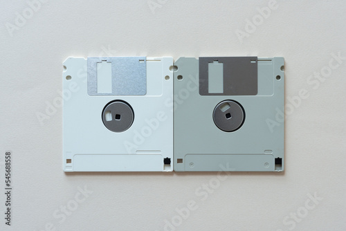 verso side of two 3 1/2 inch floppy diskettes on blank paper