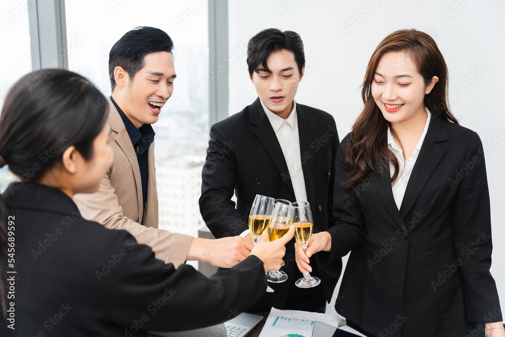 group of Asian business people holding glasses of wine to celebrate new year group of Asian business people holding glasses of wine to celebrate new year
