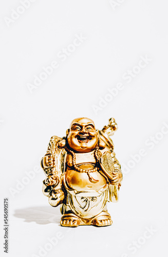 Isolated Golden budai hotei is a Chinese folkloric deity. Name means "Cloth Sack", a laughing buddha on the sand Note to the reviewer: Budai, Hotei, Pu-Tai is the right words, there is such a words