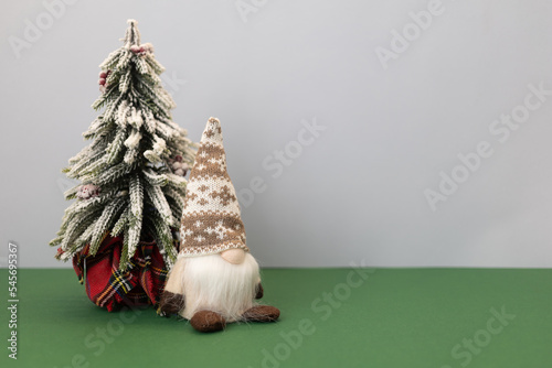 christmas tree and gnome gonk with copy space background photo