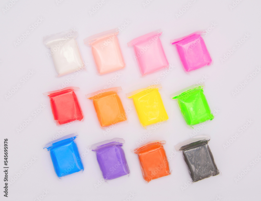 Vivid air plasticine, a soft colorful air mass for children's art that dries after modeling isolated on white background. Modeling clay for kids education and development. Vivid air plasticine, a soft colorful air mass for children's art that dries after modeling isolated on white background. Modeling clay for kids education and development.