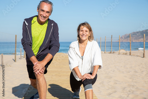 Fototapeta Close-up of happy aged couple exercising in summer
